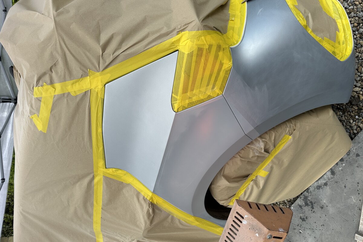 Dent area masked and prepared for paint