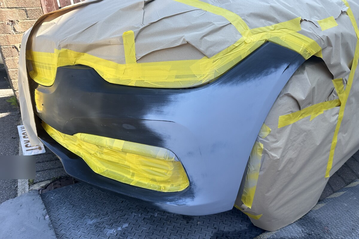 Bumper masked and painted during repair